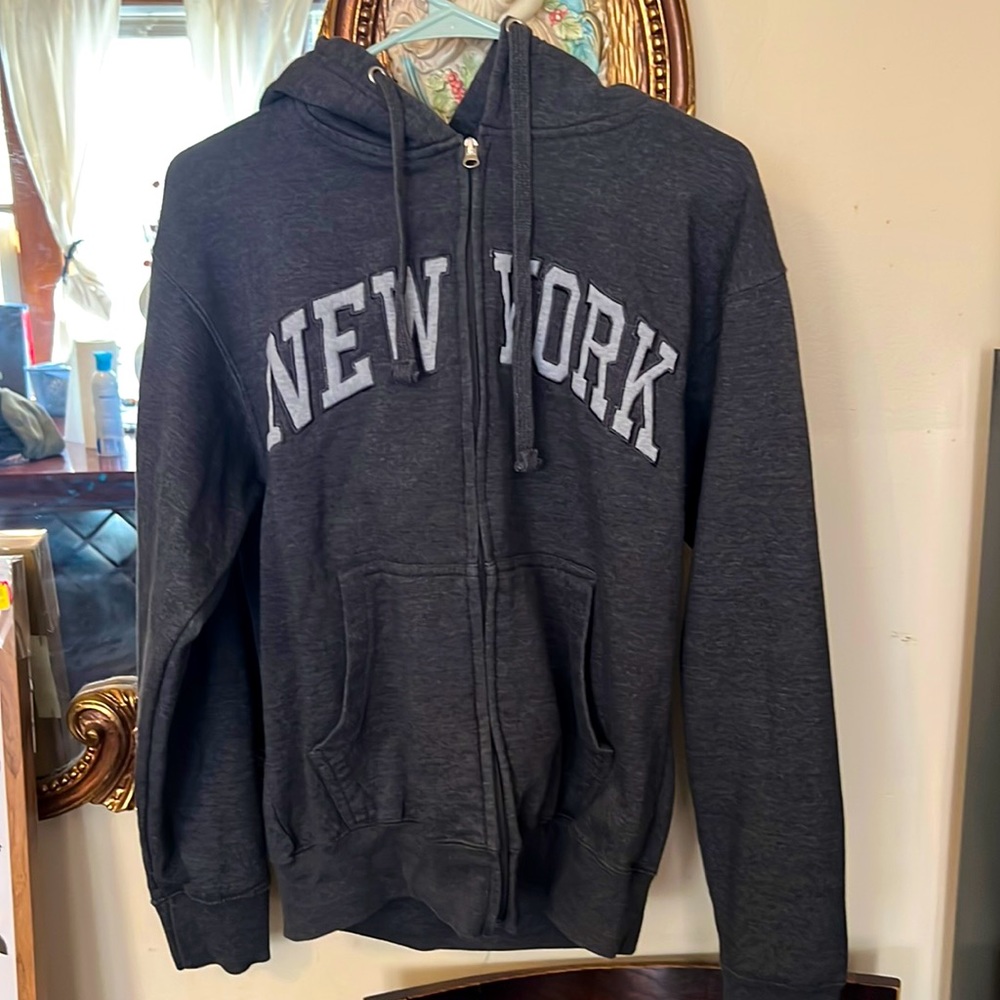 A gray sweater that exudes the vibrant spirit of New York City!